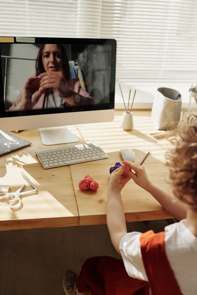 A child engaging in an online art therapy