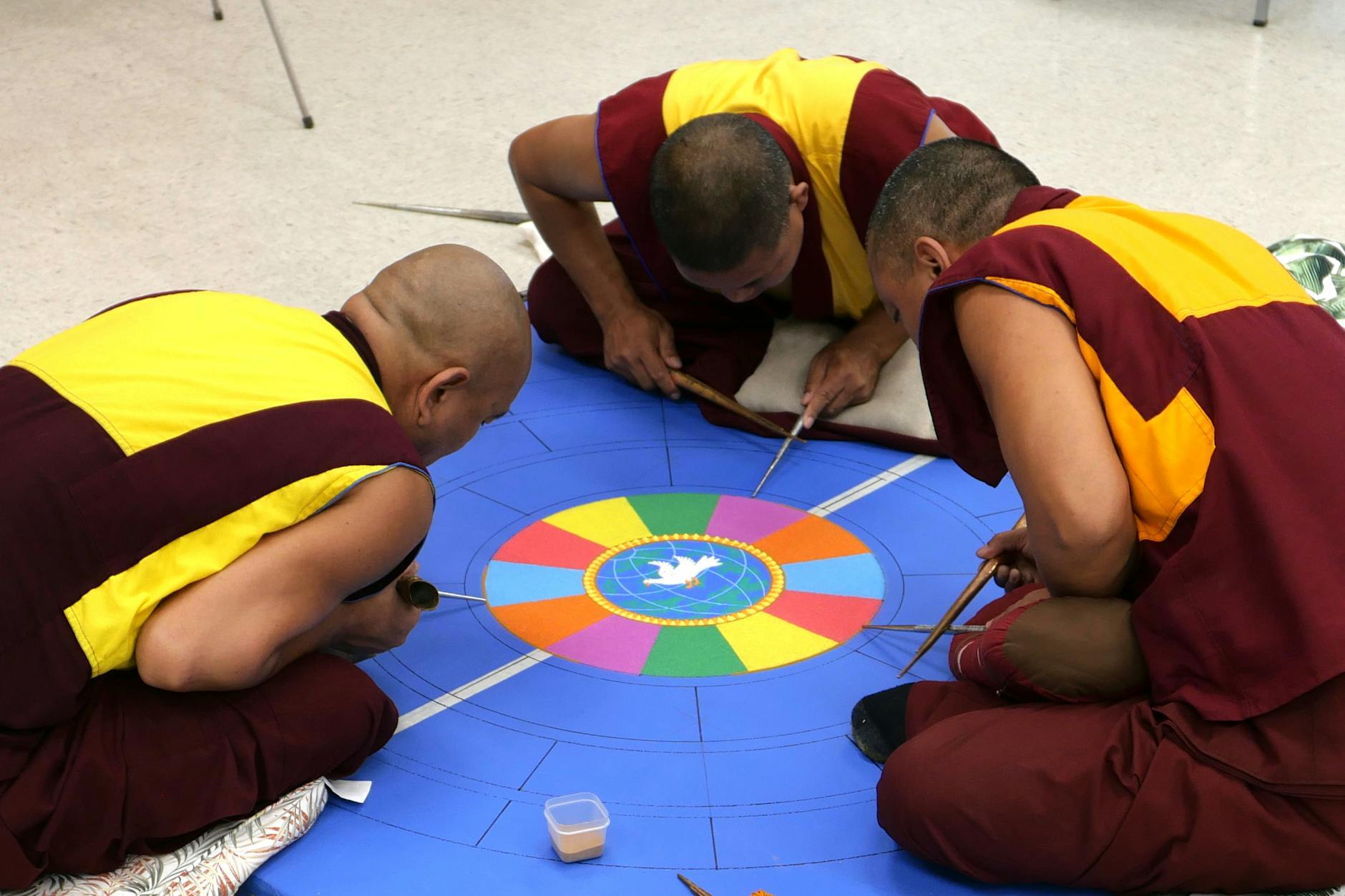 tibetan monks creating sand mandala in florida